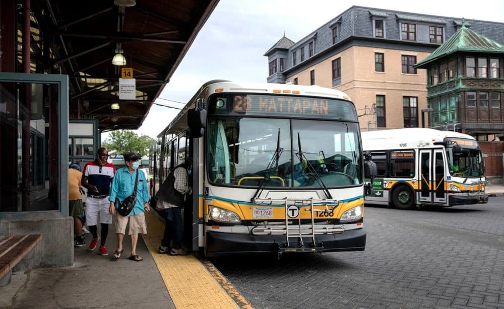 A 28 bus to Mattapan picks up passengers at the Nubian Square bus station. (Robin Lubbock/WBUR)