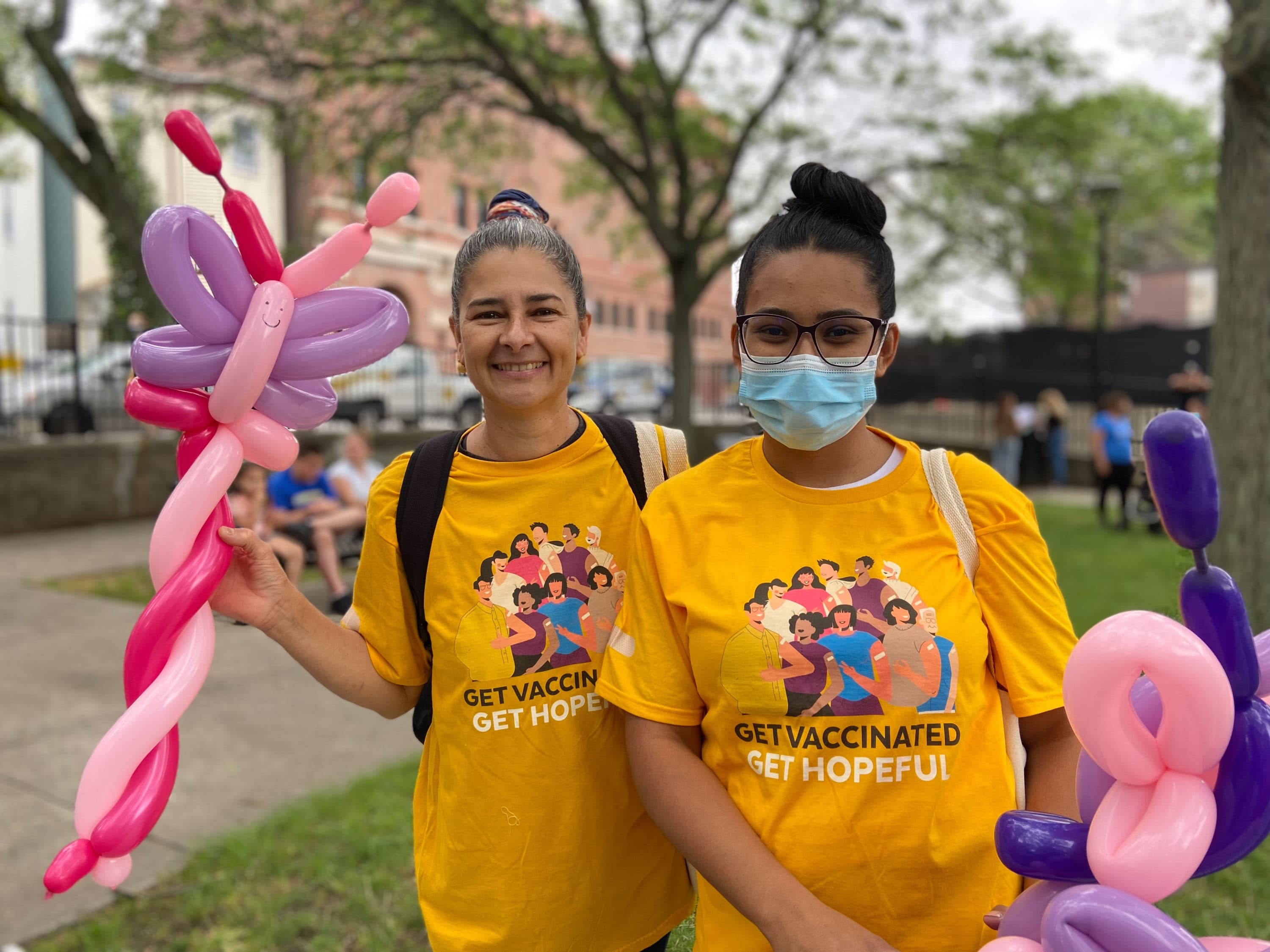 Edna Bias (left) and Miury Nenman attend a "Day of Hope" vaccination event Saturday in Boston. (Quincy Walters/WBUR)