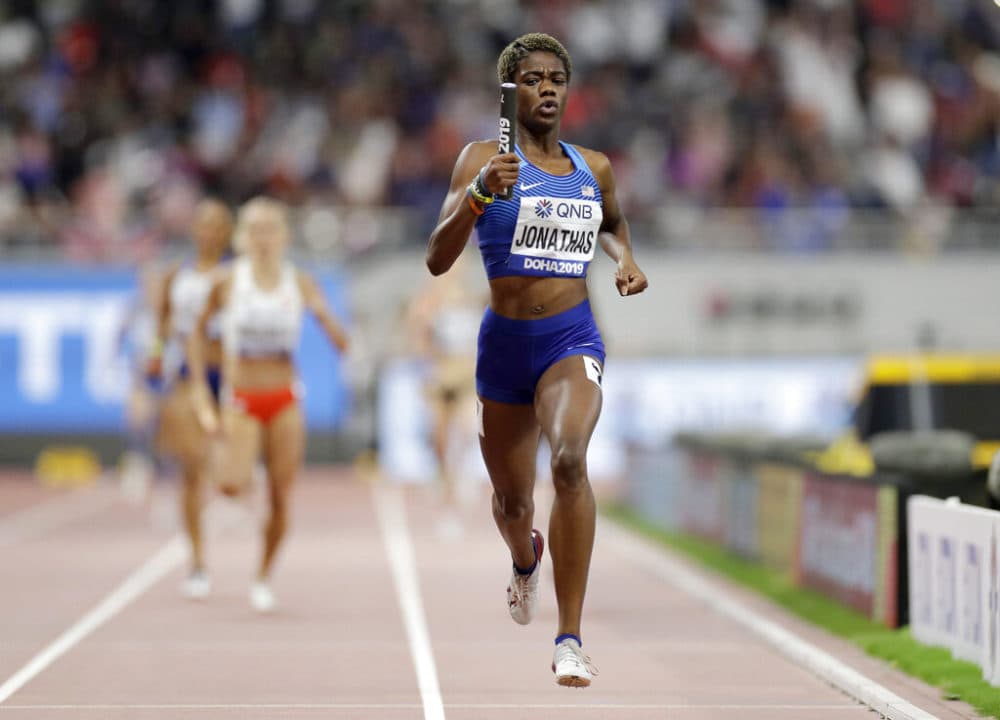 Wadeline Jonathas races to the finish line to lead the team to gold medal in the women's 4x400 meter relay final at the World Athletics Championships in Doha, Qatar, in 2019. (Petr David Josek/AP)