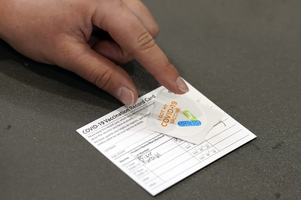 A COVID-19 vaccination card is displayed at the Banning Recreation Center, April 13, 2021, in Wilmington, Calif. (Marcio Jose Sanchez)/AP