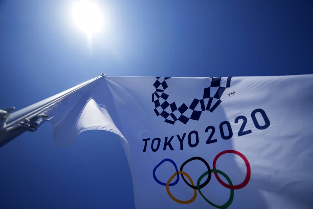 A Tokyo 2020 Olympic flag flies over the bleachers at Ariake Tennis Center in Tokyo. (Kiichiro Sato/AP)