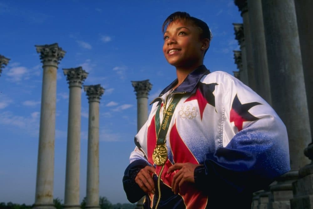 Gymnast Dominique Dawes of the USA, a medalist at the 1996 Centennial Olympic Games in Atlanta, Georgia, poses outside Washington, D.C. (Doug Pensinger/Allsport)