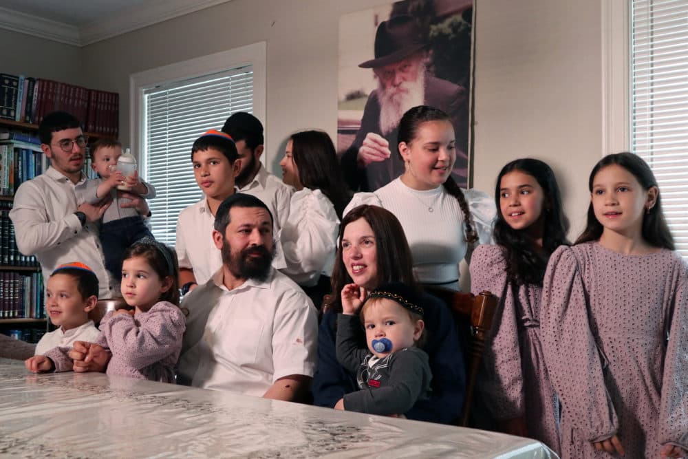 Rabbi Shlomo Noginski with his family at his home in Brighton. (Adrian Ma/WBUR)