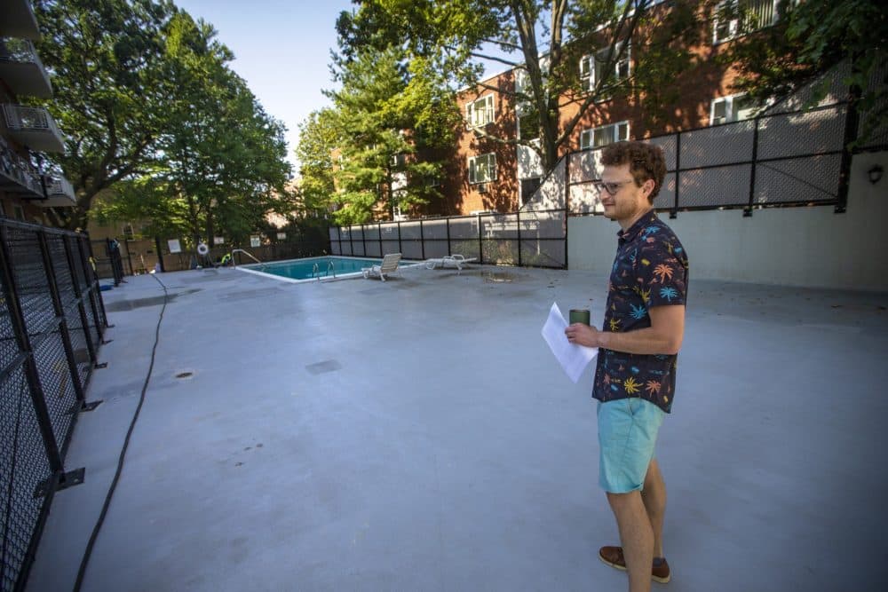 Leon Vasershteyn checks out the pool of a condominium for sale in Brookline. (Jesse Costa/WBUR)