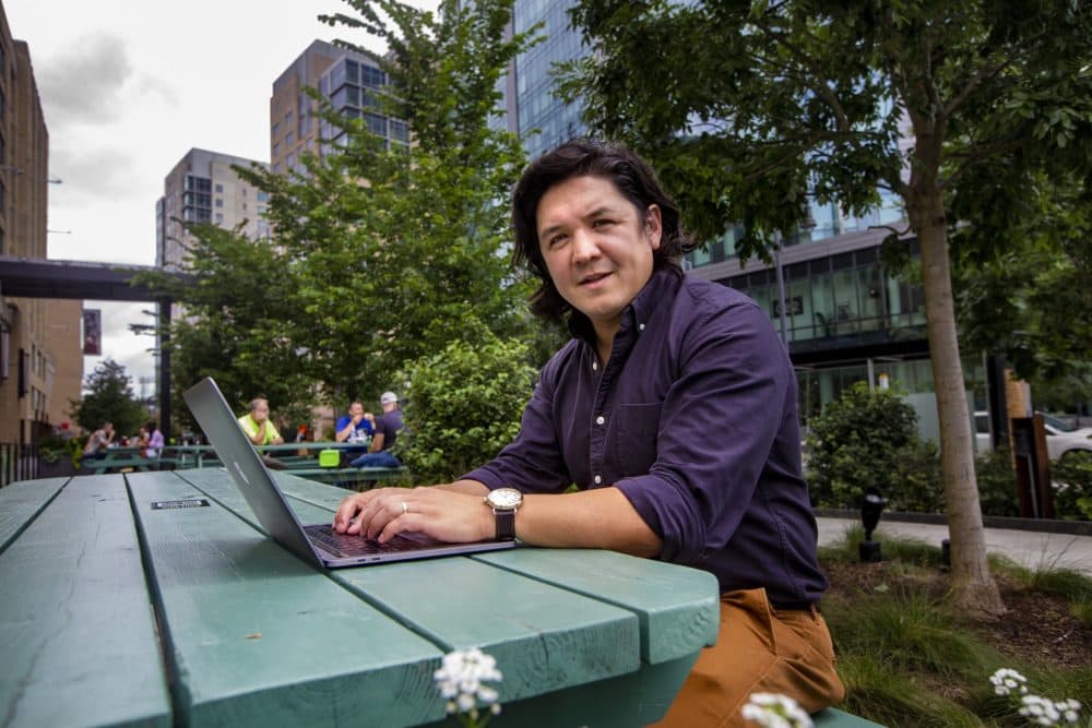 Peter James, assistant professor at Harvard Medical School, works outside at Landmark Center in the Fenway. (Jesse Costa/WBUR)