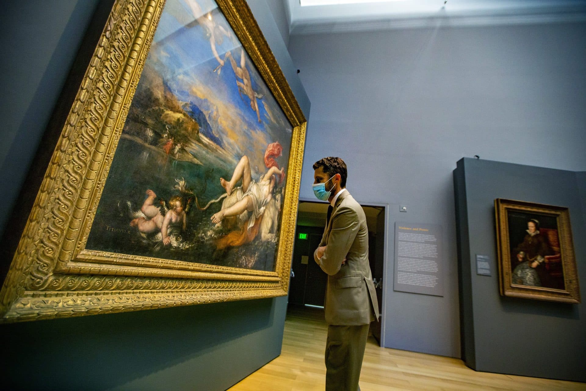 Curator Nat Silver closely examines Titian’s &quot;The Rape of Europa&quot; during a check of the newly installed exhibit of the artist’s work in the Hostetter Gallery at the Isabella Stewart Gardner Museum. (Jesse Costa/WBUR)