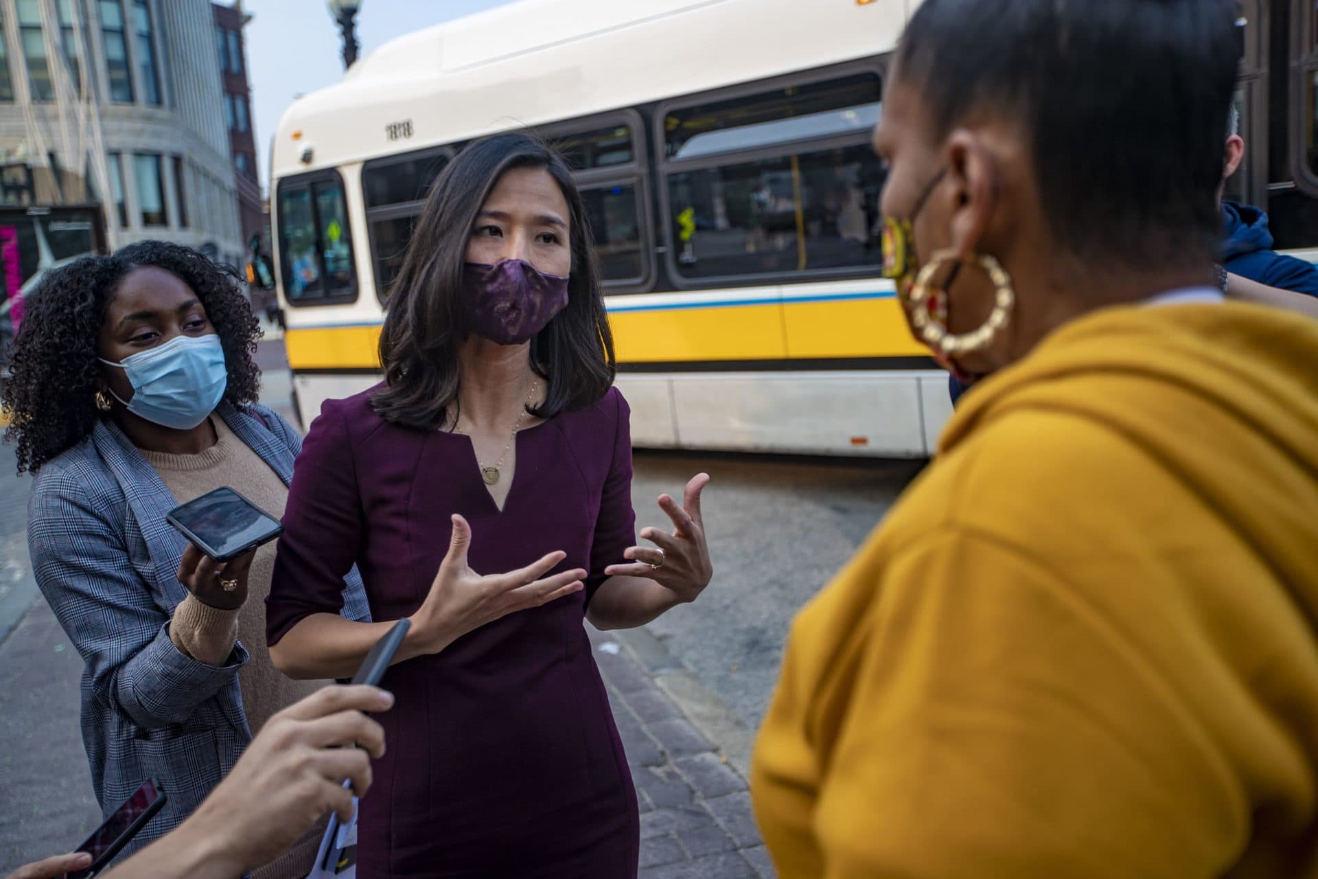 Mayoral candidate Michelle Wu speaks with a Roxbury resident during a campaign appearance outside of Nubian Station on Sept. 15, 2020. (Jesse Costa/WBUR)
