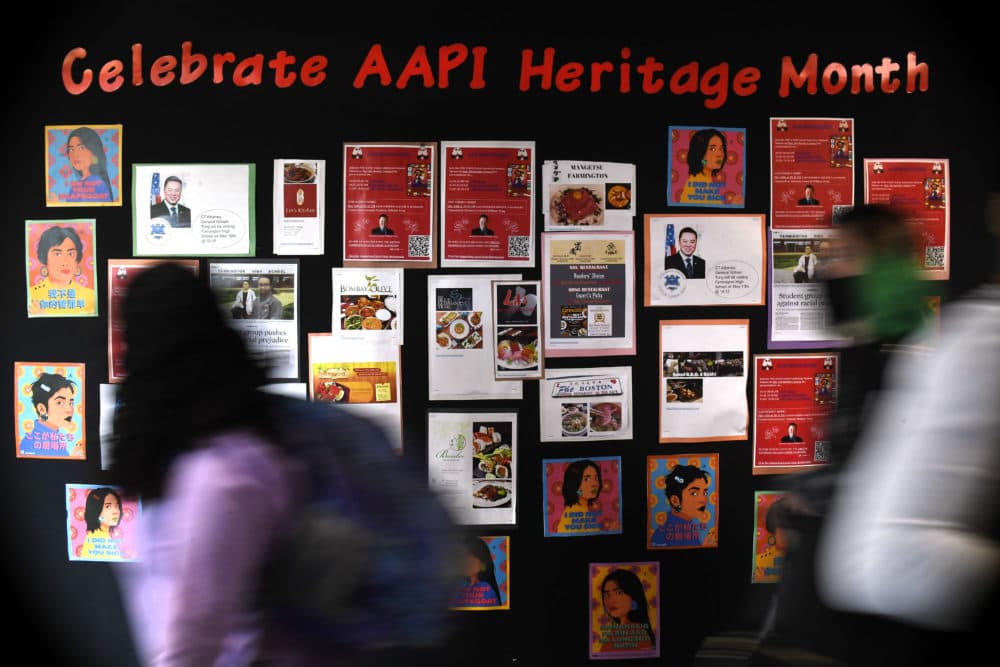 Students walk past a display for Asian Pacific American Heritage Month at Farmington High School in Farmington, Conn on May 10, 2021. The year of anti-Asian violence has led students and teachers to advocate for reexamining how Asian American studies and history are taught in public schools. (Jessica Hill/AP)