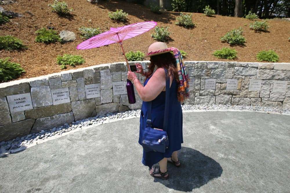 In this 2017 file photograph, Karla Hailer, a fifth-grade teacher from Scituate, Mass., shoots a video where a memorial stands at the site in Salem, Mass., where five women were hanged as witches more than 325 years earlier.(Stephan Savoia/AP File)