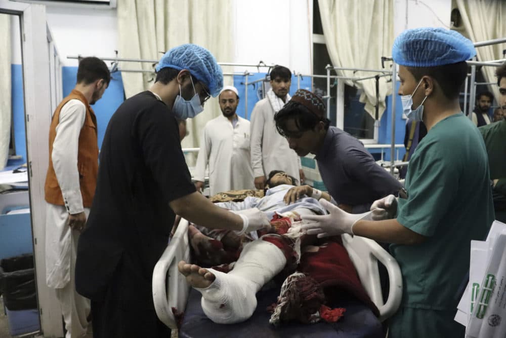 A victim receives medical assistance in a hospital after he was wounded in the deadly attacks outside the airport in Kabul, Afghanistan, Thursday, Aug. 26, 2021. (Khwaja Tawfiq Sediqi/AP)