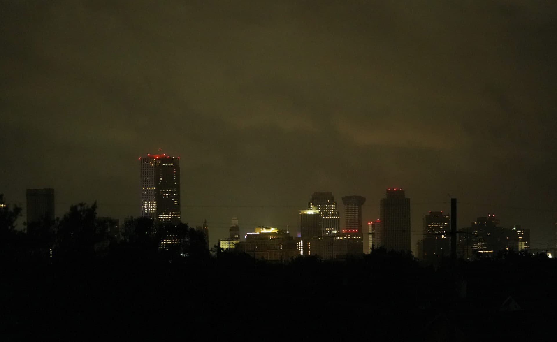 Downtown buildings are lit by backup generators after Hurricane Ida knocked out power to the city, Monday, Aug. 30, 2021, in New Orleans, La. (Eric Gay/AP Photo)