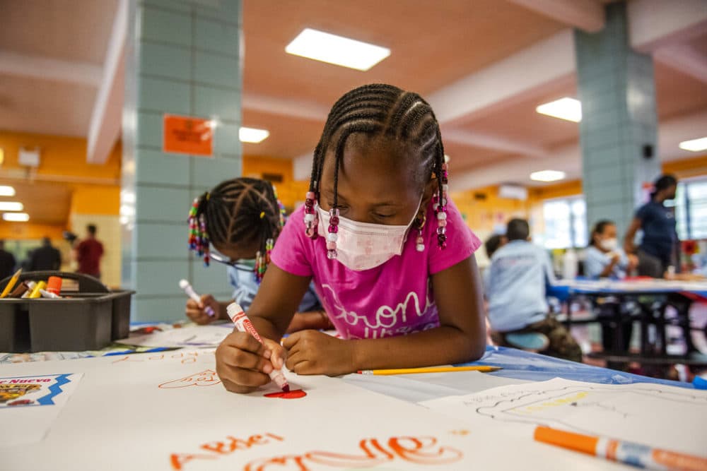Liliana Lambert, 6, writes down and draws positive affirmations on poster board at P.S. 5 Port Morris, a Bronx elementary school, Tues., Aug. 17, 2021 in New York. (Brittainy Newman/AP)