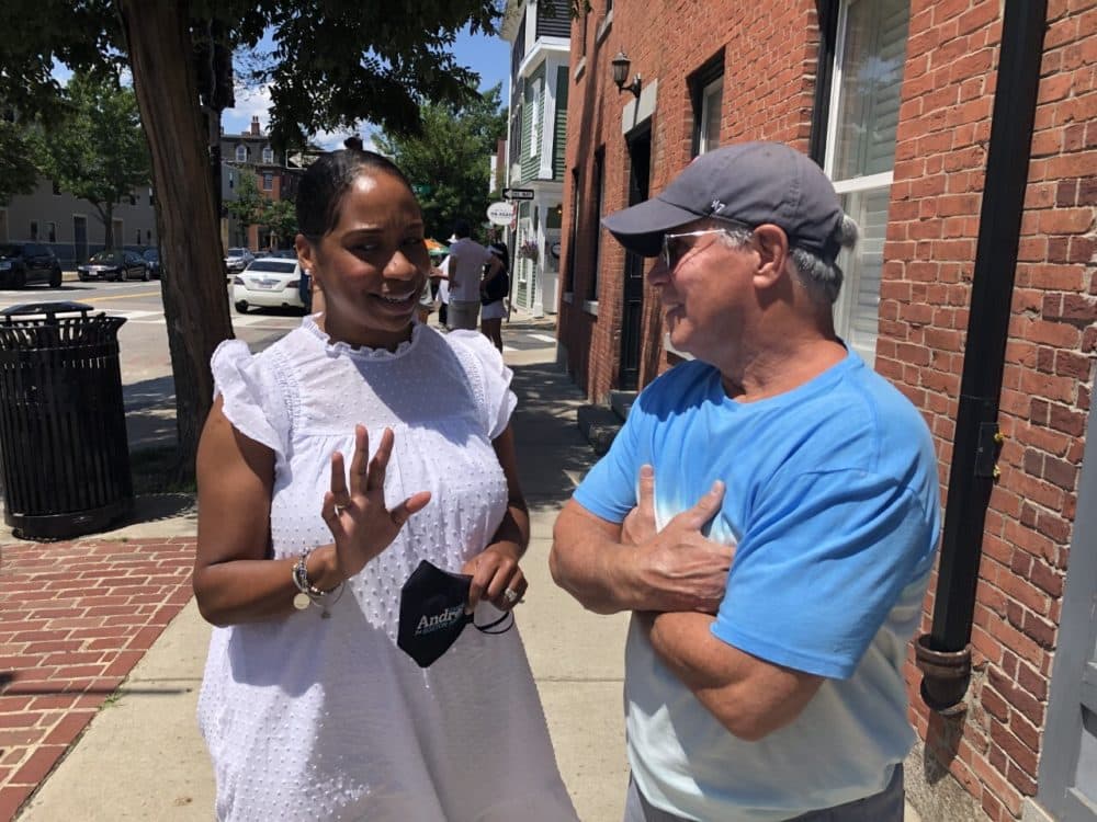 Boston City Councilor Andrea Campbell talks with Doug MacDonald of Charlestown. (Anthony Brooks/WBUR)