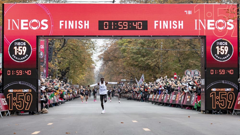 Eliud Kipchoge celebrates as he crosses finish line and makes history to become the first human being to run a marathon in under two hours. (Thomas Lovelock for The INEOS 1:59 Challenge)