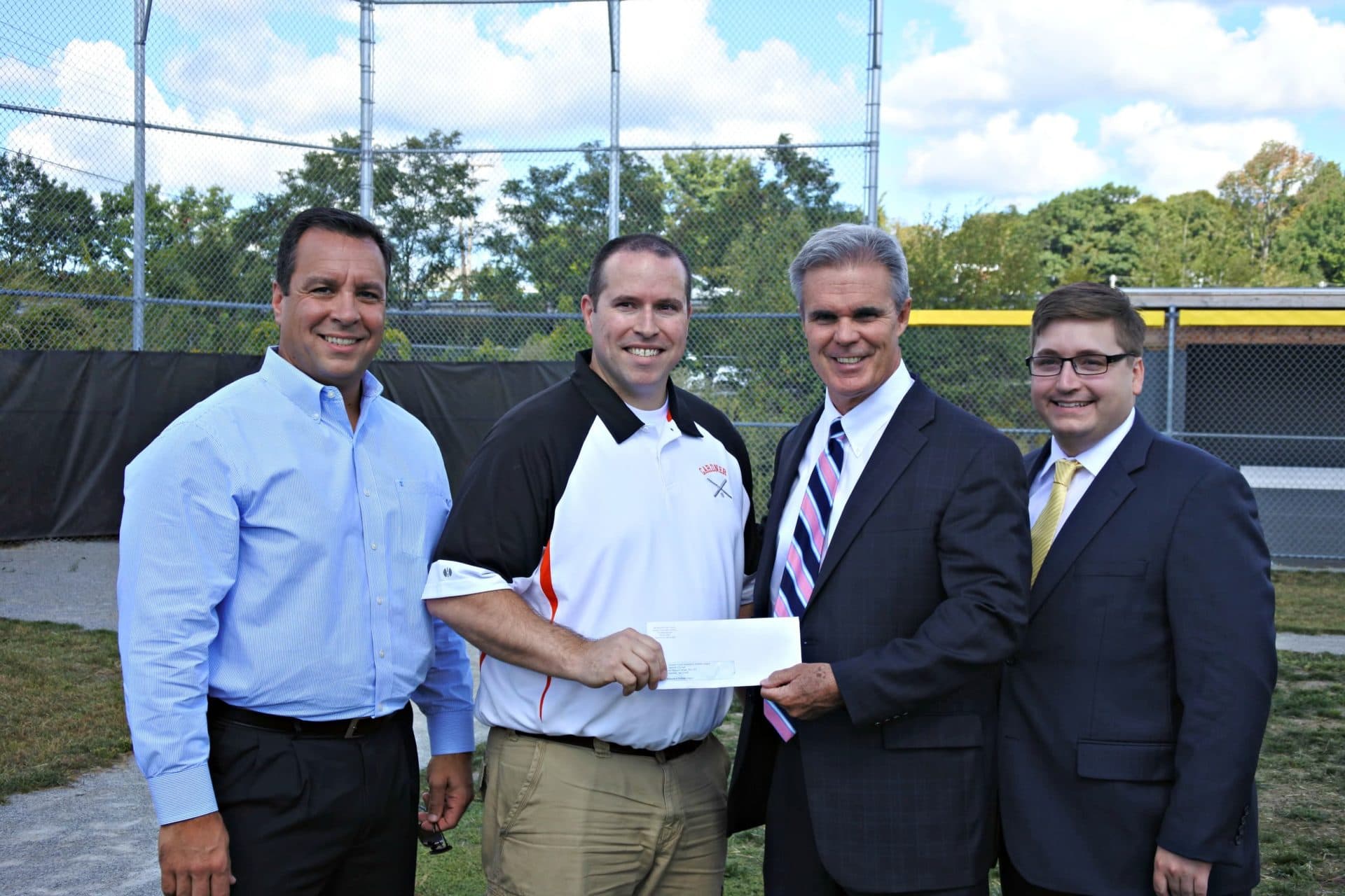 District Attorney Joseph D. Early Jr. presents a check from his county's drug forfeiture funds to Gardner Youth Baseball &amp; Softball League to help improve their field. The league’s president, Kevin Robillard, accepted the check and they were joined by former Gardner Mayor Mark Hawke and state Rep. Jonathan Zlotnik. (Photo published on Worcester County District Attorney's Office website in 2016)