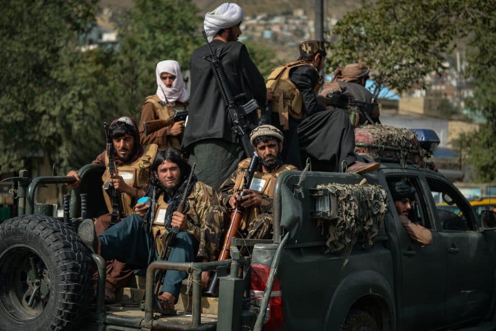 Taliban fighters patrol along a street in Kabul on Aug. 31, 2021. The Taliban joyously fired guns into the air and offered words of reconciliation as they celebrated defeating the United States and returning to power after two decades of war that devastated Afghanistan. (Hoshang Hashimi/AFP via Getty Images)
