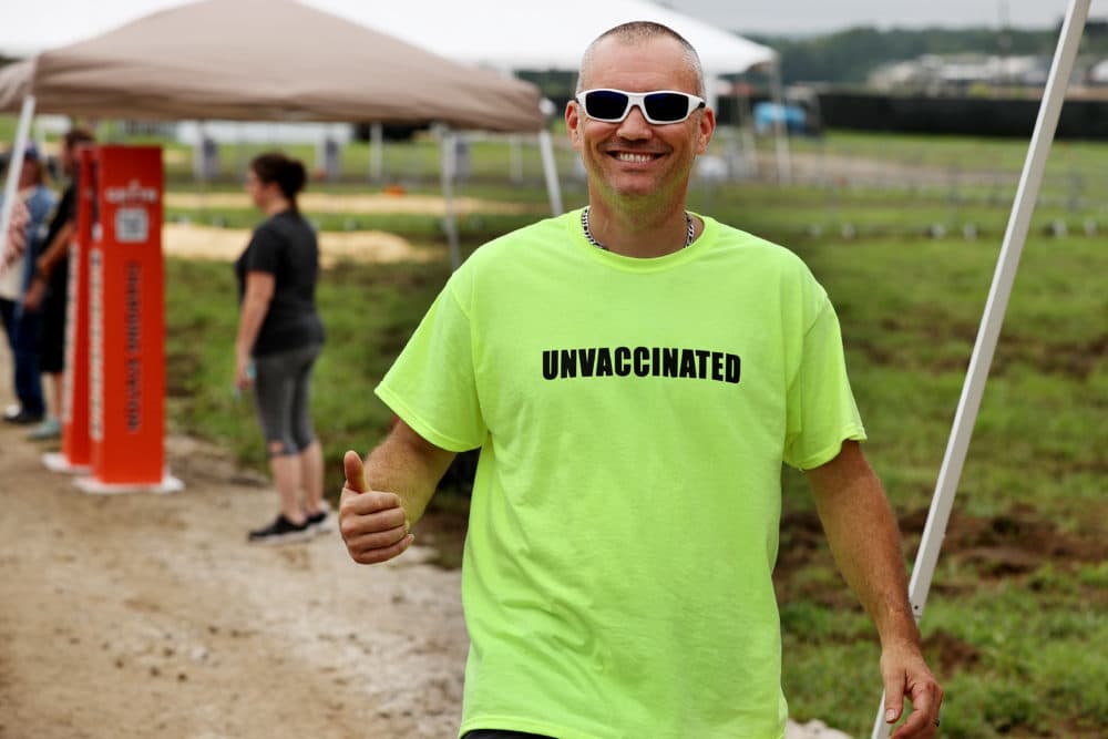 A man wears an 'UNVACCINATED' t-shirt ahead of U.S. President Donald Trump's "Save America" rally at York Family Farms on August 21, 2021 in Cullman, Alabama. With the number of coronavirus cases rising rapidly and no more ICU beds available in Alabama, the host city of Cullman declared a COVID-19-related state of emergency two days before the Trump rally. According to the Alabama Department of Public Health, 67.5% of the state's population has not been fully vaccinated. (Chip Somodevilla/Getty Images)