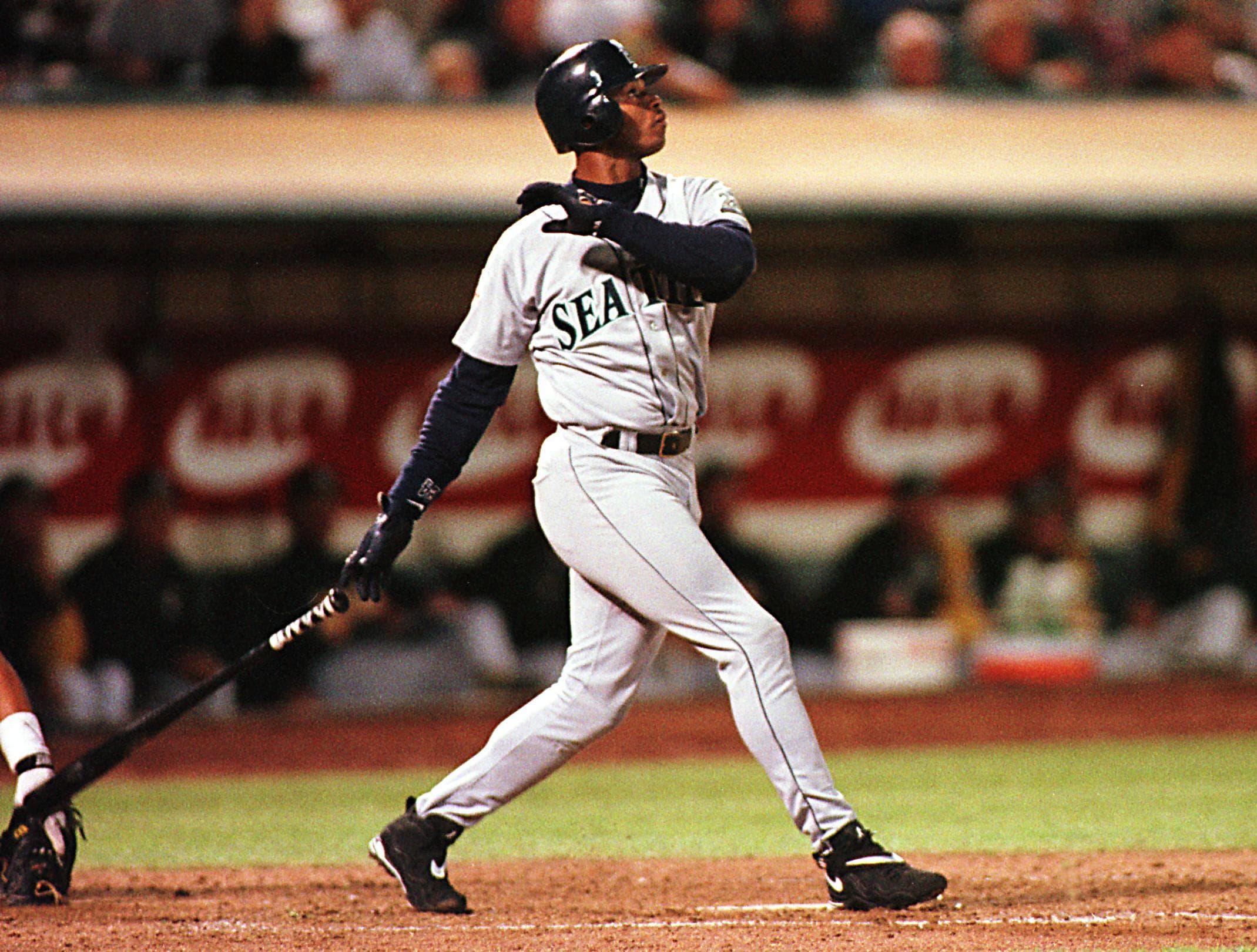 Seattle Mariners Ken Griffey Jr. watches his second home run sail out of the park. (John G. Mabanglo/AFP via Getty Images)