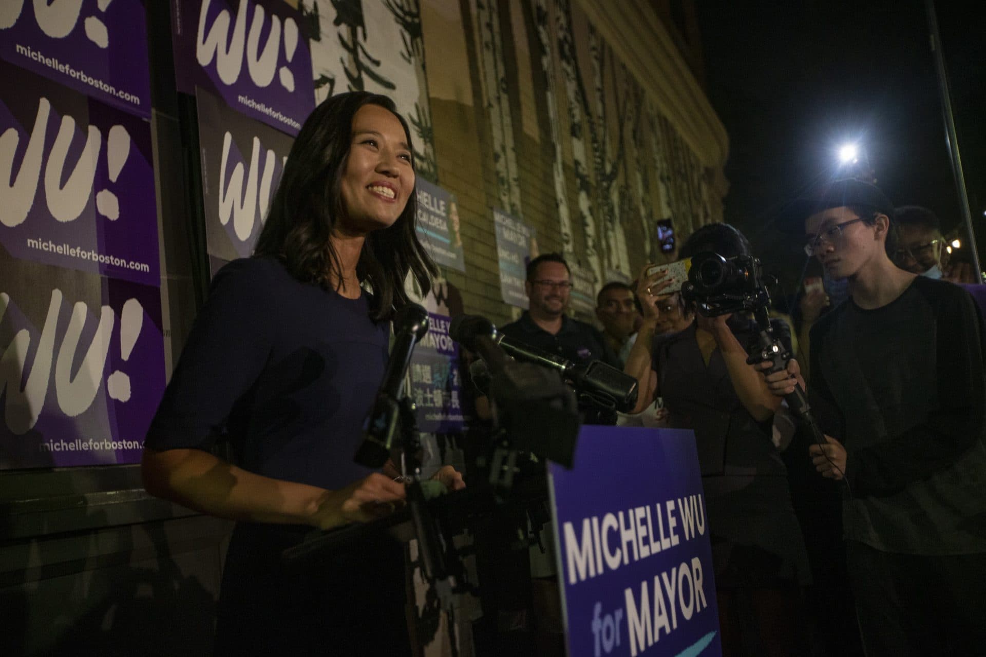 A jubilant Michelle Wu speaks to supporters at Distraction Brewing in Roslindale before the official voting has been finalized. (Jesse Costa/WBUR)