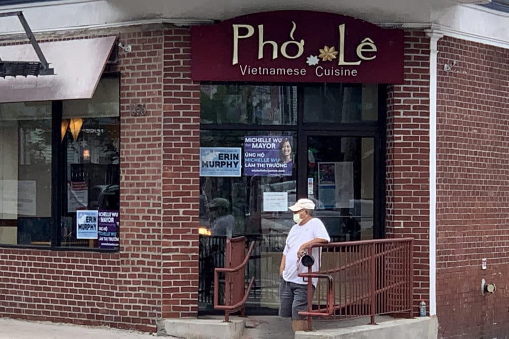 A Vietnamese restaurant on Dorchester Avenue shows support for mayoral candidate Michelle Wu. (Simón Rios/WBUR)