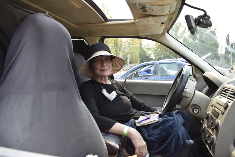 Gael Von Lackum tried to decompress after her first night at the American Red Cross evacuation site at the Reno-Sparks Convention Center in Reno, Nev., on Sept. 1. She evacuated her home near Stateline, Calif., due to the threat of the Caldor Fire. (Lucia Starbuck/KUNR Public Radio)