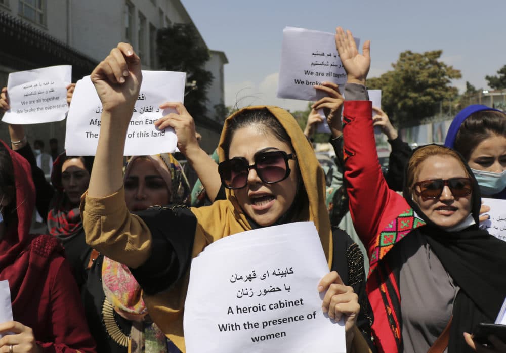 Women gather to demand their rights under the Taliban rule during a protest in Kabul, Afghanistan, Friday, Sept. 3, 2021. (AP Photo/Wali Sabawoon)