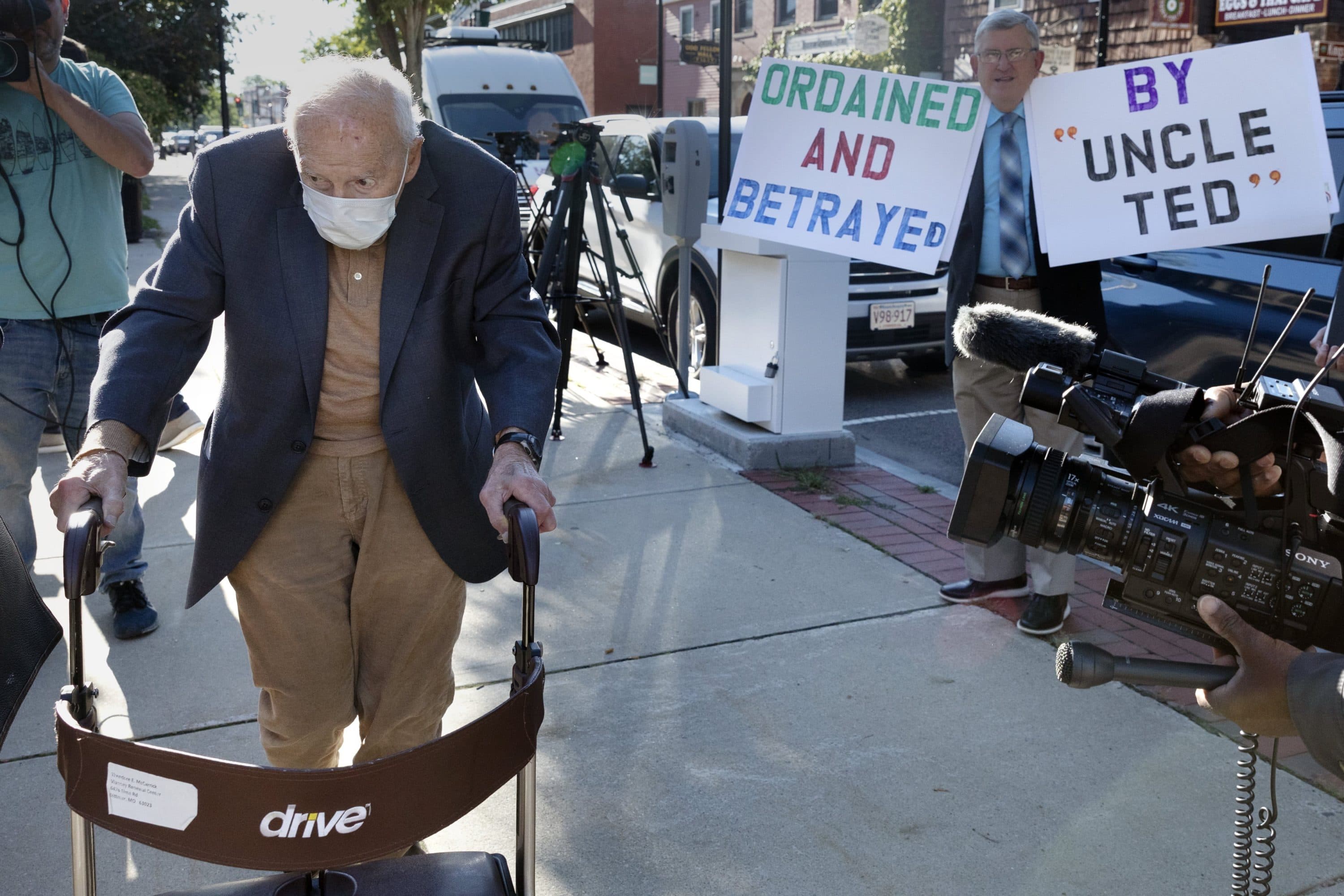Former Cardinal Theodore McCarrick, left, arrives at Dedham District Court, Sept. 3, 2021, in Dedham, Mass. (Michael Dwyer/AP)