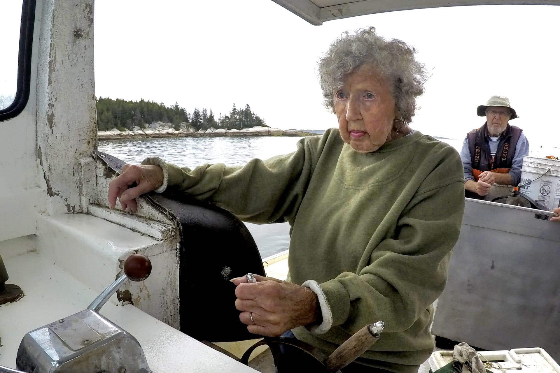 Virginia Oliver, age 101, pilots her son Max Oliver's boat.  (Robert F. Bukaty/AP)