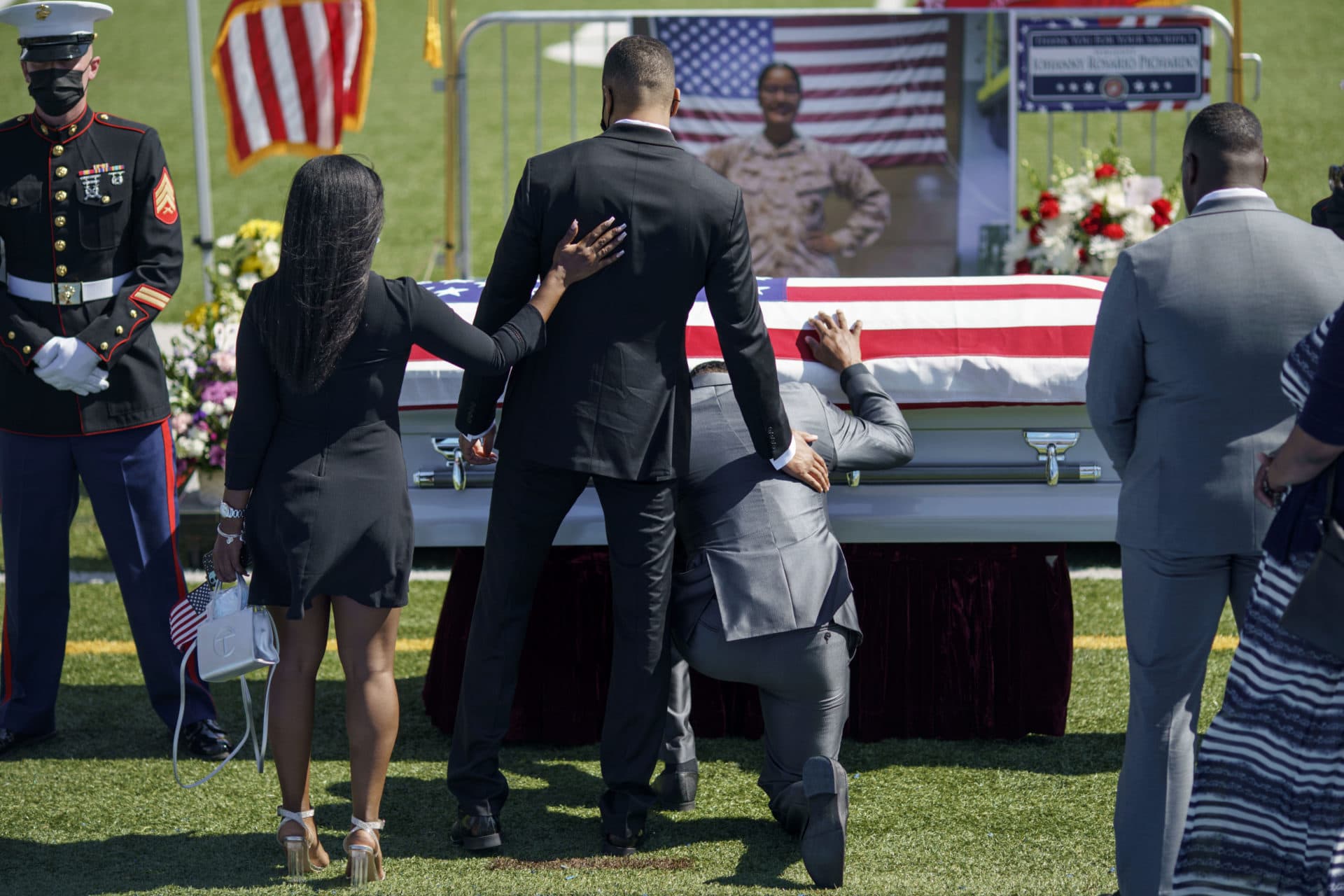 Mourners pay their respects to Sgt. Johanny Rosario. (David Goldman/AP)