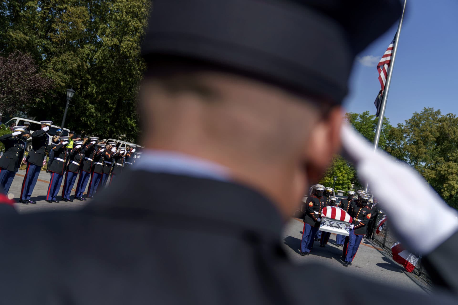 The casket of Sgt. Johanny Rosario is carried into Veterans Memorial Stadium for a public wake in her hometown of Lawrence. (David Goldman/AP)