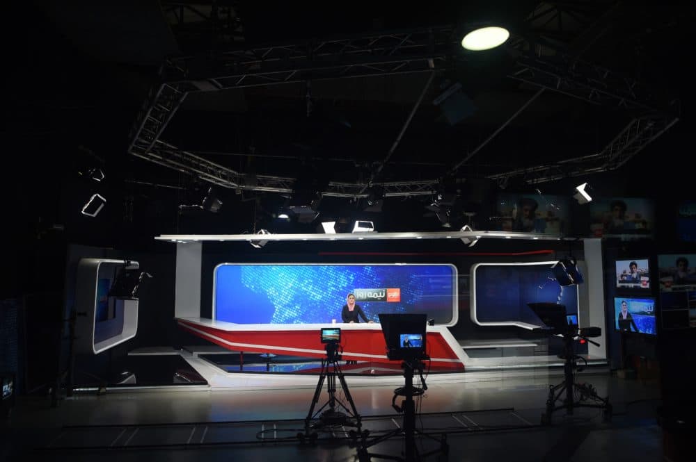 Afghan presenter Zarmina Mohammadi for TOLOnews takes part in a live broadcast at in Kabul in 2018. (WAKIL KOHSAR/AFP via Getty Images)