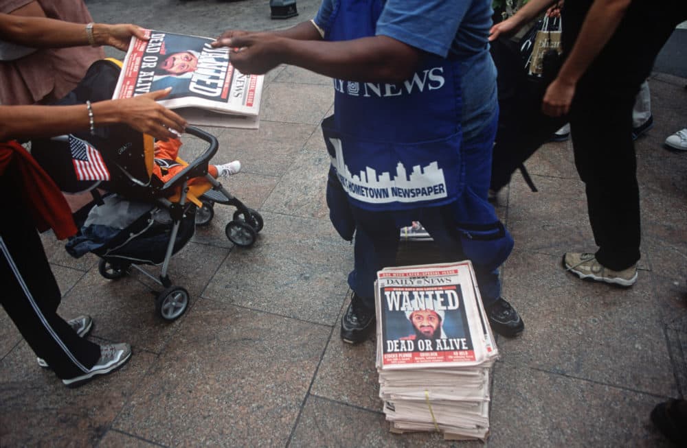 A week after the 9/11 terrorist attack on the Twin Towers and the Pentagon, a newspaper vendor sells copies of the New York Daily News with the face of Osama bin Laden and a cowboy-era outlaw's headline of 'Dead or Alive,' September 18, 2001.(Richard Baker/ Getty Images)