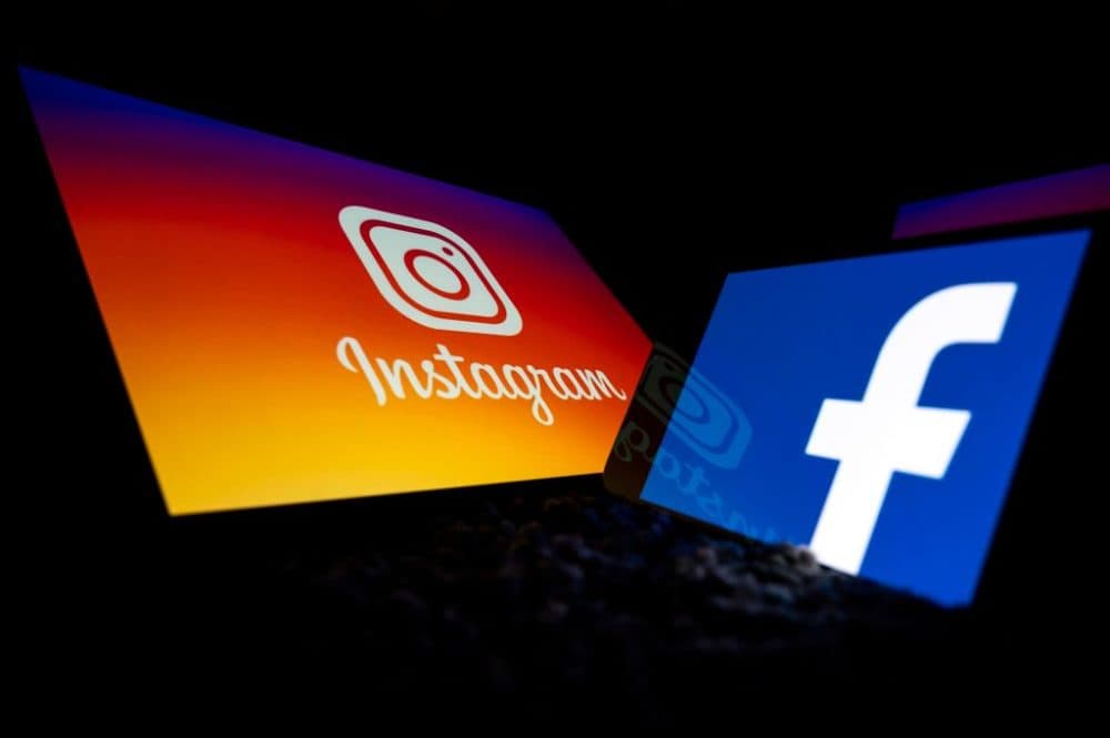 Logos of Facebook and Instagram on the screens of a tablet and a mobile phone. (Lionel Bonaventure/AFP/Getty Images)