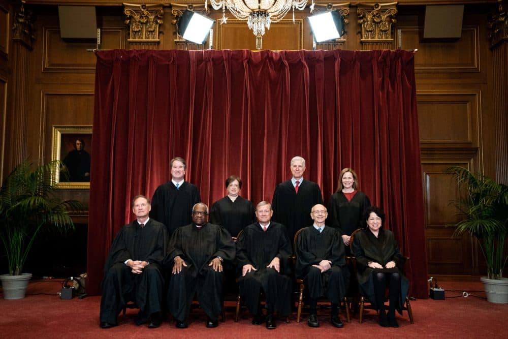 Seated from left: Associate Justice Samuel Alito, Associate Justice Clarence Thomas, Chief Justice John Roberts, Associate Justice Stephen Breyer and Associate Justice Sonia Sotomayor, standing from left: Associate Justice Brett Kavanaugh, Associate Justice Elena Kagan, Associate Justice Neil Gorsuch and Associate Justice Amy Coney Barrett pose during a group photo of the Justices at the Supreme Court in Washington, DC on April 23, 2021. (Erin Schaff/AFP via Getty Images)