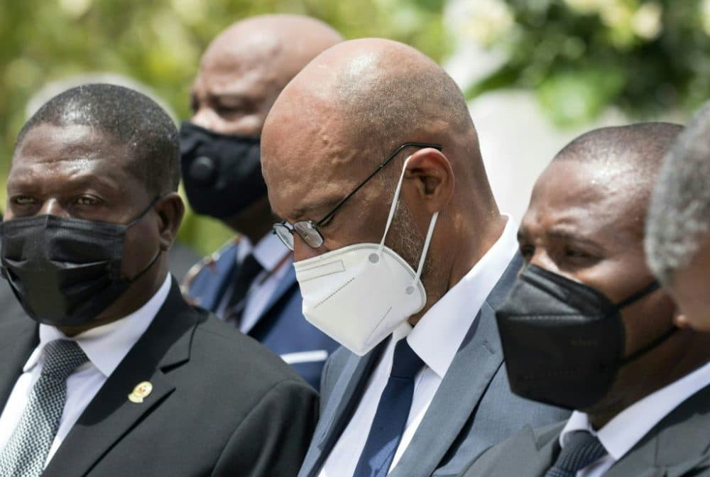 Prime Minister Ariel Henry (center) attends a ceremony in honor of late Haitian President Jovenel Moise at the National Pantheon Museum in Port-au-Prince, Haiti, on July 20, 2021. (Photo by Valerie Baeriswyl Getty Images)