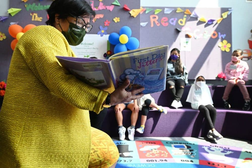 Los Angeles Unified School District (LAUSD) interim Superintendent Megan Reilly reads a book called &quot;First Day Jitters&quot; to students in the library at Kim Elementary School on the first day of the school year, in Los Angeles, California, August 16, 2021. (Robyn Beck/AFP/Getty Images)