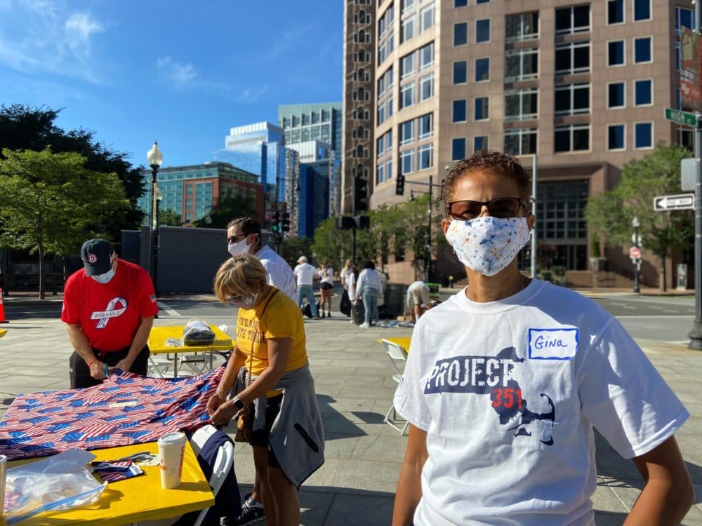 Gina Galarza, of Taunton, volunteered at Rose Kennedy Greenway on Sept. 11, 2021 to assemble care packages for American military personnel overseas and to unhoused veterans in Boston. (Quincy Walters/WBUR)