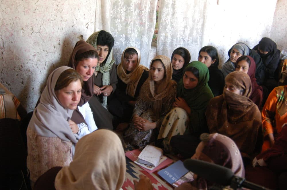 The author and her Beyond the 11th co-founder, Patti Quigley, attend a literacy class in Afghanistan circa 2006. (Courtesy Susan Retik)