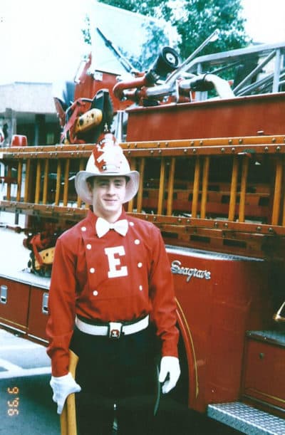 Welles Crowther beside a firetruck. (Courtesy of Alison Crowther)
