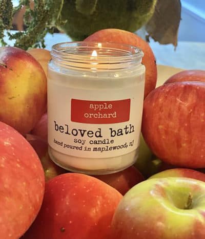 A Beloved Bath soy candle in the scent apple orchard. (Courtesy of Beloved Bath)