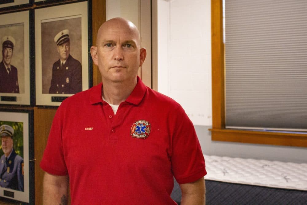 Fire Chief Alex Schaeffer stands in front of recently-constructed bunk rooms in the Edgartown Fire Station, built so firefighters commuting from off-island can have a place to sleep after their shifts. (Wilder Fleming/WBUR)