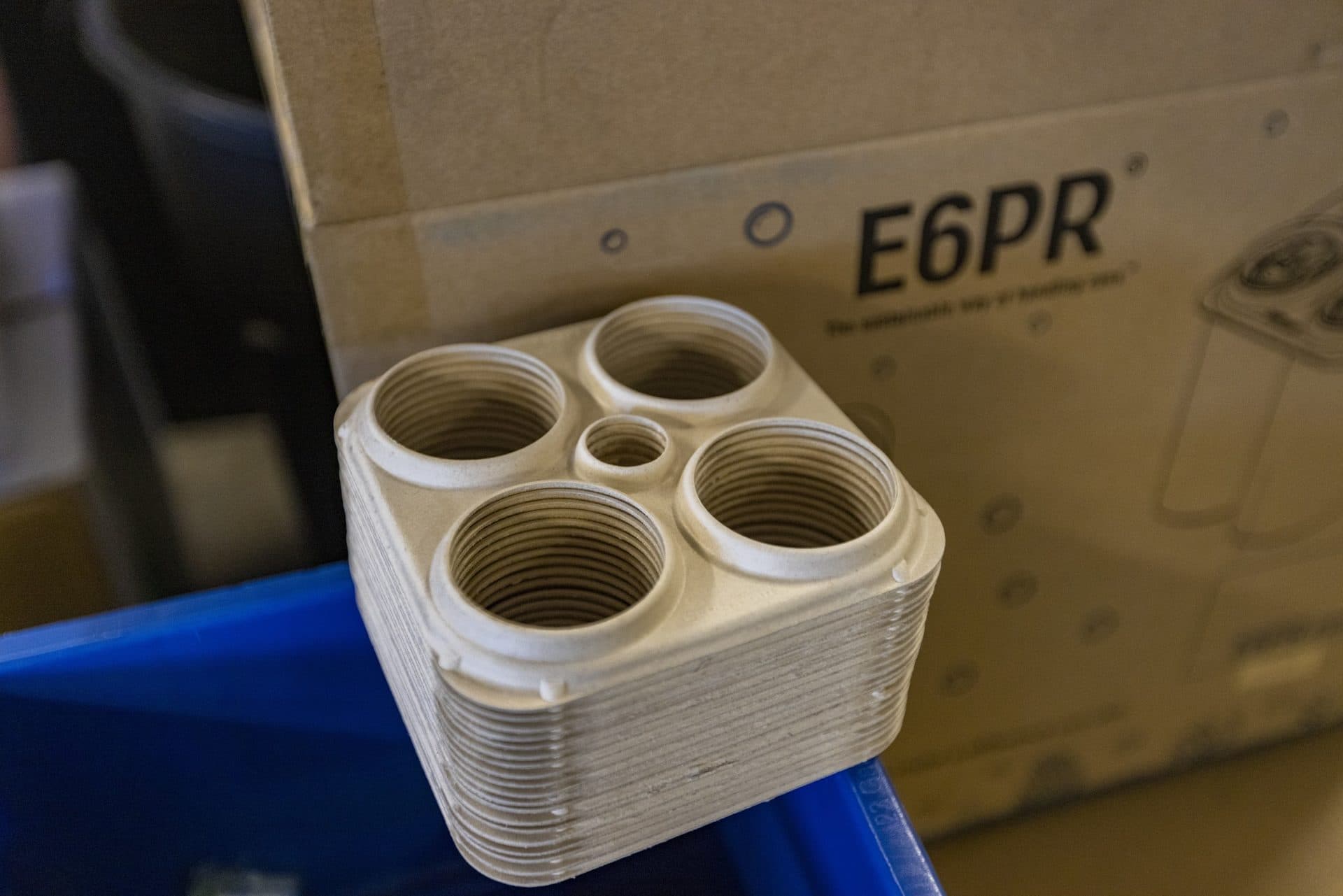 A stack og E6PR beer carrier rings is the first eco-friendly six-pack ring made from fiber by-product waste, designed to replace plastic rings many craft breweries are currently using to package their beer. (Jesse Costa/WBUR)