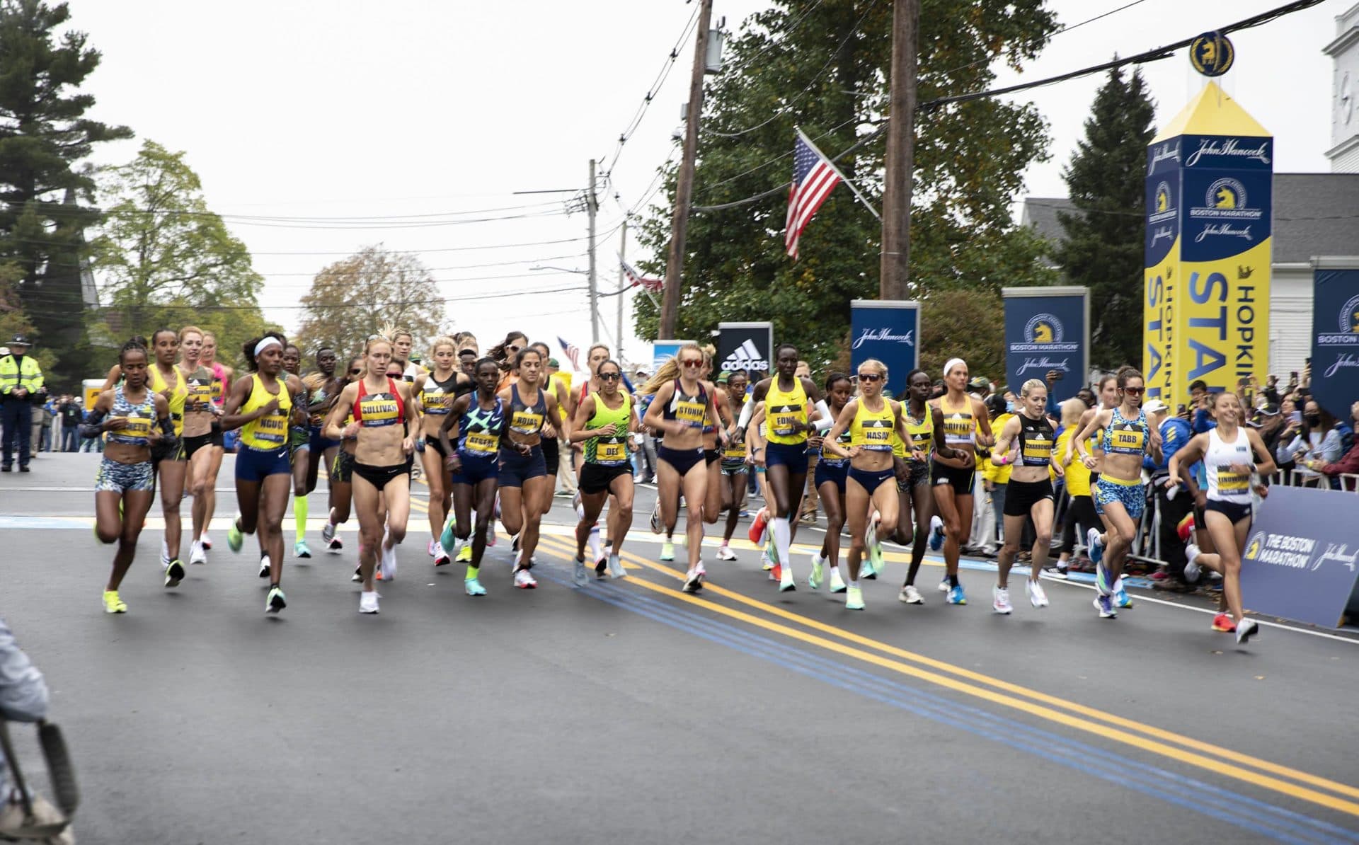 The professional women cross the start line in the 125th Boston Marathon. (Robin Lubbock/WBUR)