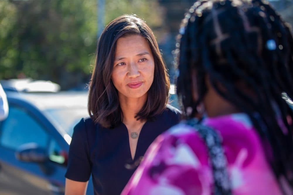 Boston mayoral candidate Michelle Wu greets with supporters at Readville Station in Hyde Park. (Jesse Costa/WBUR)