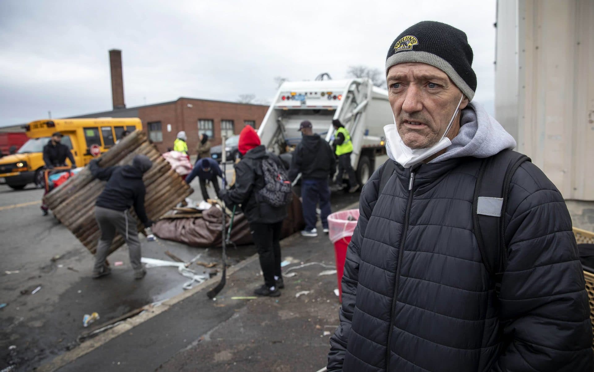 Ron Geddes stands on Southampton Street as a crew clears makeshift shelters from the sidewalk. (Robin Lubbock/WBUR)