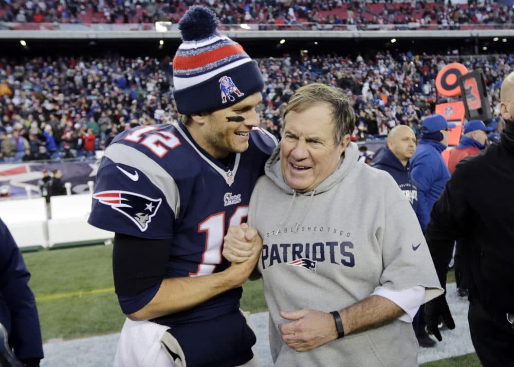 In this Dec. 14, 2014, file photo, New England Patriots quarterback Tom Brady, left, celebrates with head coach Bill Belichick after defeating the Miami Dolphins 41-13 in an NFL football game in Foxborough, Mass. (AP Photo/Charles Krupa, File)
