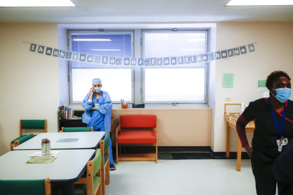 A medical worker takes a break in the employee respite facility at NYC Health + Hospitals Metropolitan, Wednesday, May 27, 2020, in New York.  (John Minchillo/AP)