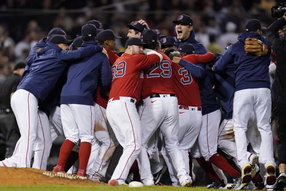 The Boston Red Sox celebrate after they defeated the New York Yankees 6-2 in an American League Wild Card playoff baseball game at Fenway Park, Oct. 5, 2021, in Boston. (Charles Krupa/AP)