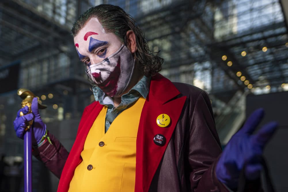An attendee dressed as the Joker poses during New York Comic Con on Thursday, Oct. 7, 2021, in New York. (Charles Sykes/Invision/AP)
