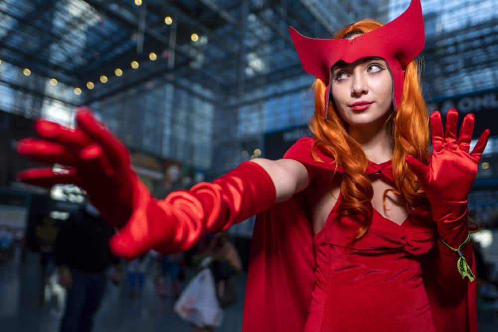 An attendee dressed as Wanda Maximoff poses during New York Comic Con on Thursday, Oct. 7, 2021, in New York. (Charles Sykes/Invision/AP)